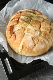 Photo of Freshly baked bread with tofu cheese on table