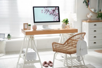 Photo of Stylish home office interior with comfortable workplace