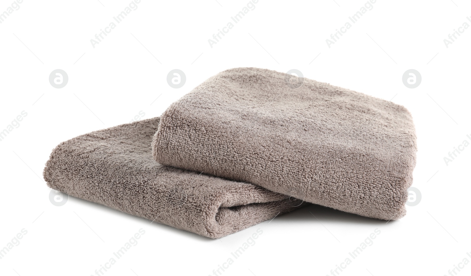 Photo of Fresh soft folded towels isolated on white