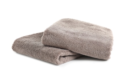 Photo of Fresh soft folded towels isolated on white