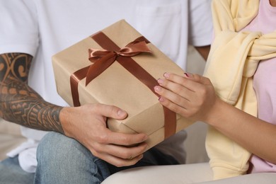 Lovely couple with beautiful gift, closeup view