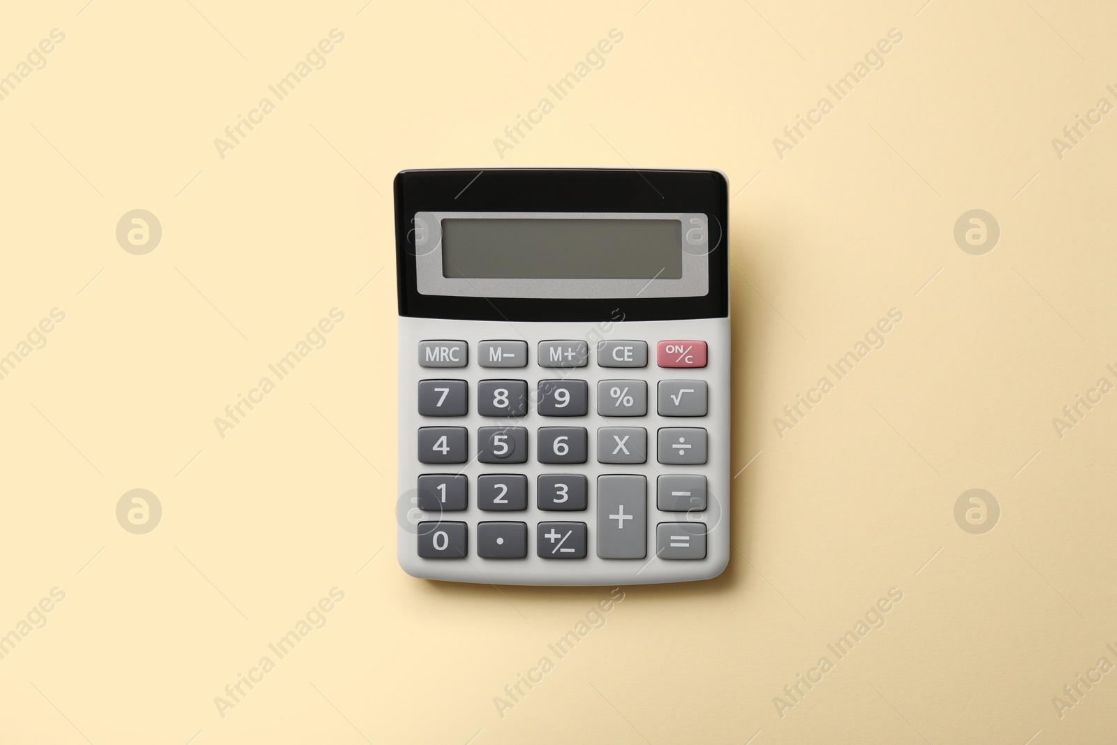 Photo of Calculator on beige background, top view. Space for text