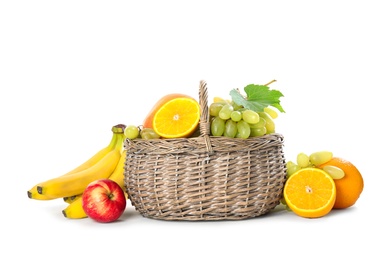 Wicker basket with different fruits on white background