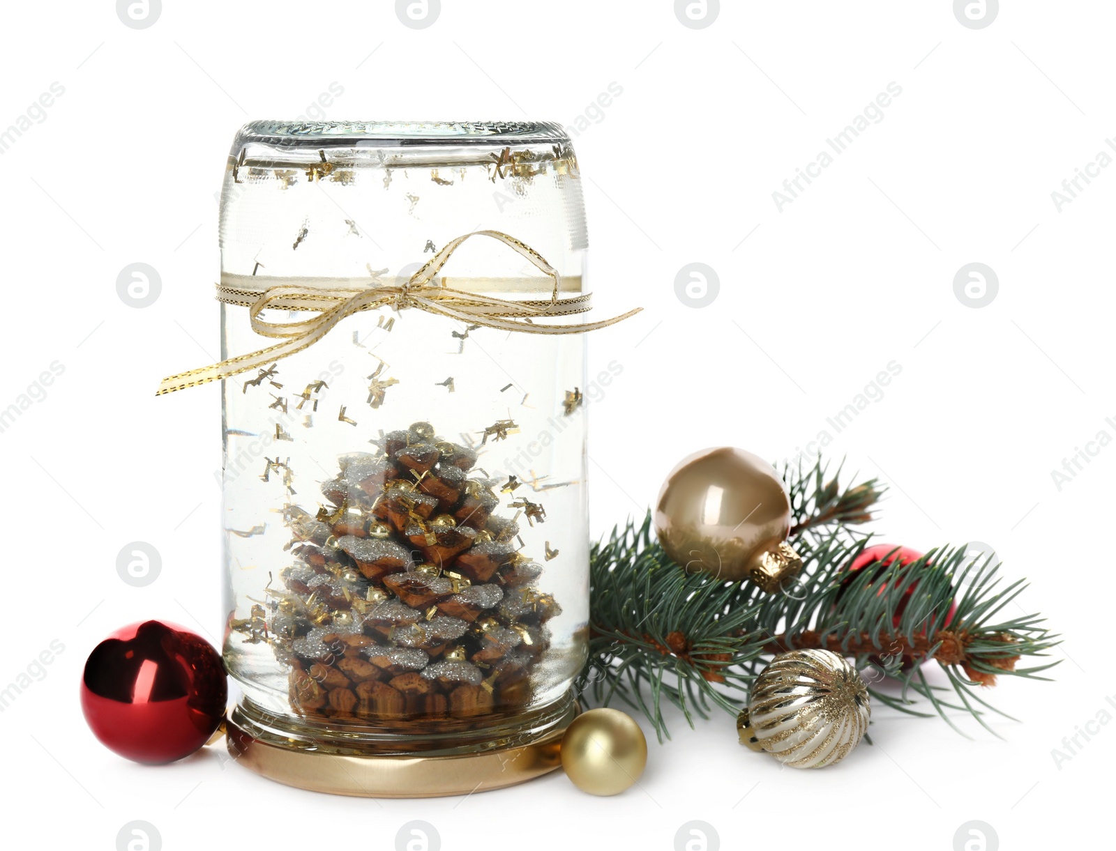 Photo of Handmade snow globe with Christmas balls and branch of fir tree on white background