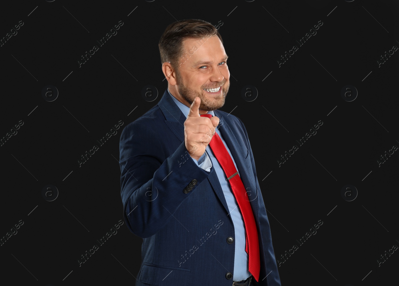 Photo of Portrait of happy mature man on black background