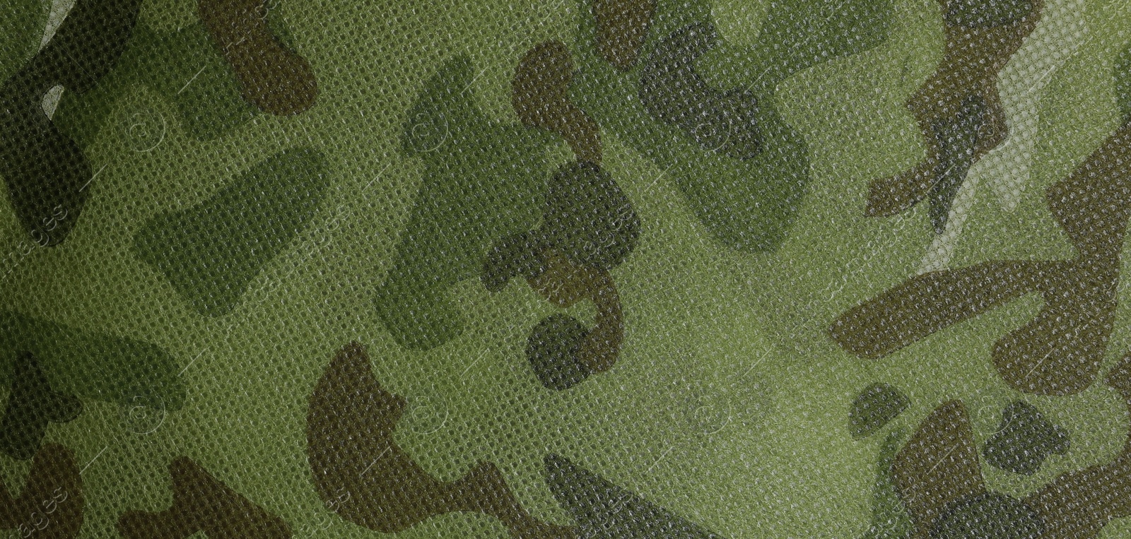 Photo of Texture of camouflage fabric as background, top view