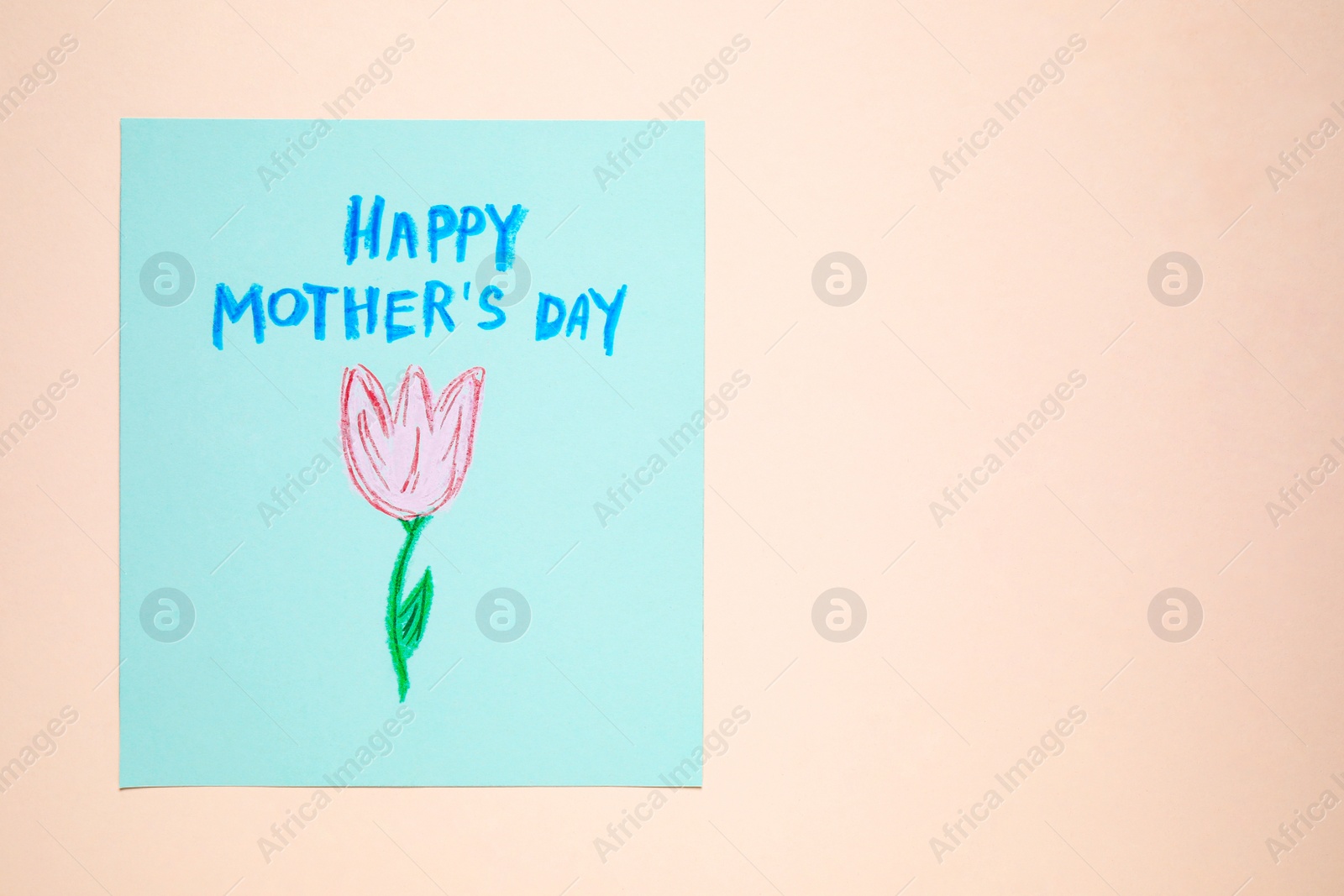 Photo of Handmade greeting card for Mother's Day on beige background, top view