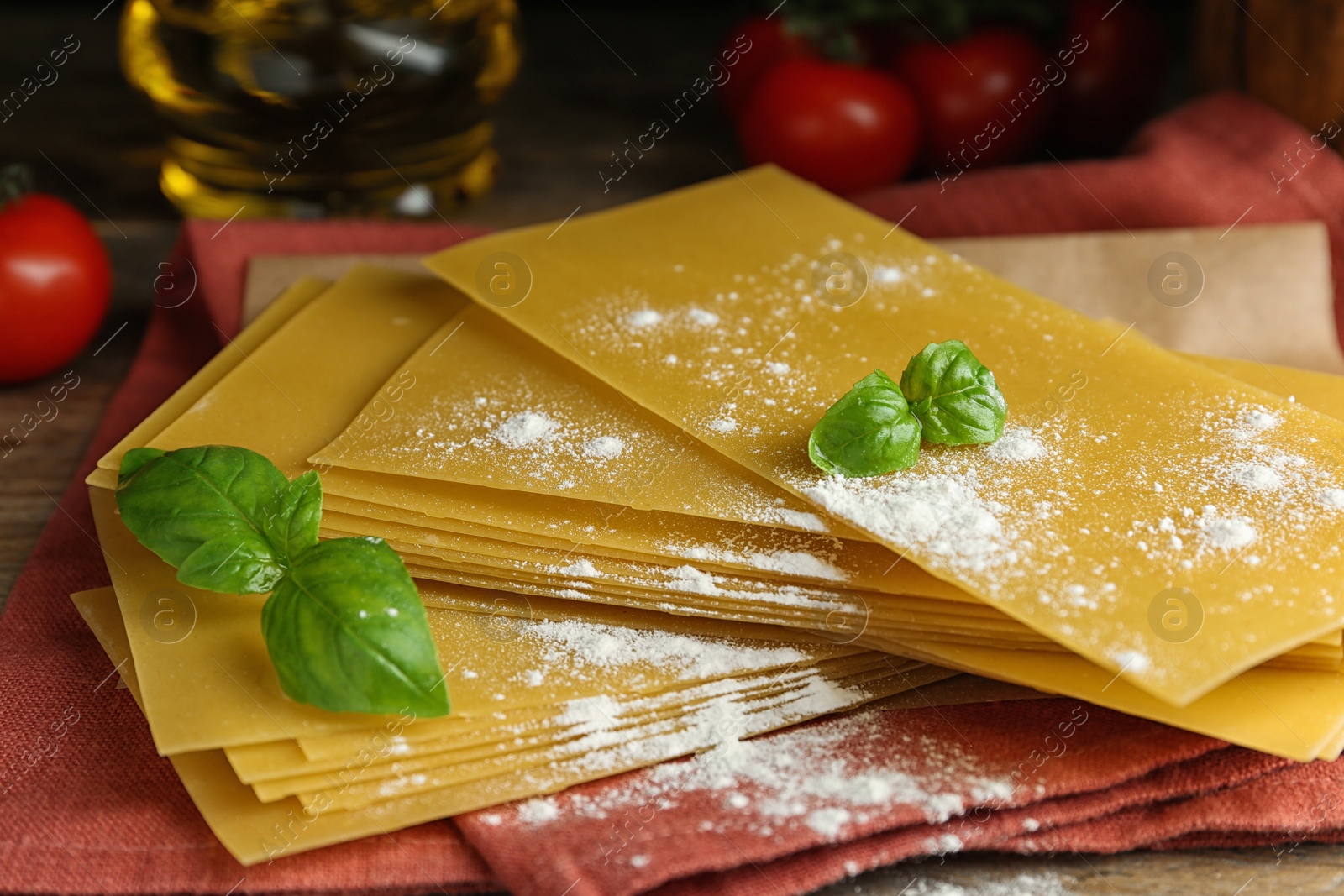 Photo of Composition with uncooked lasagna sheets on wooden table