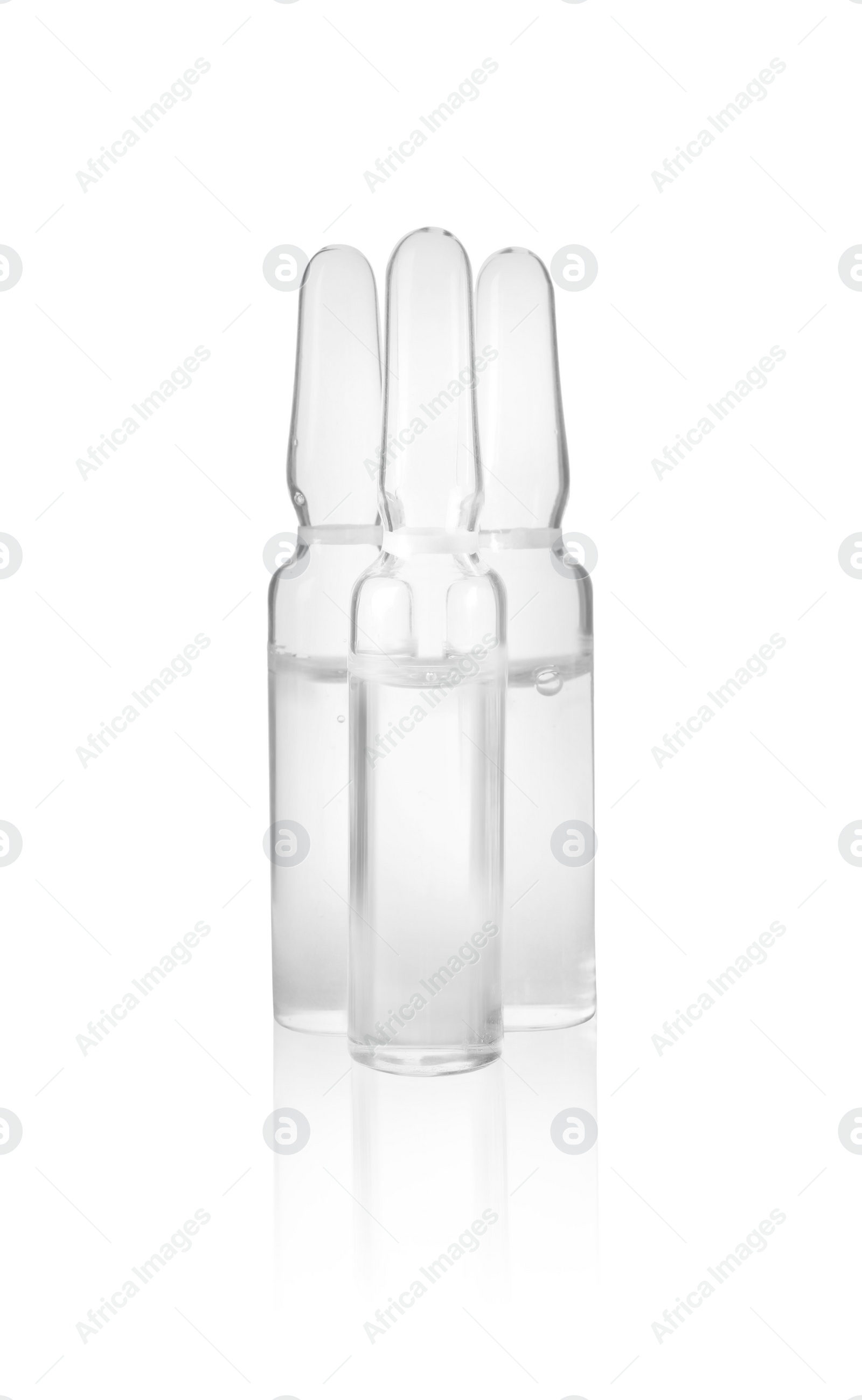 Photo of Pharmaceutical ampoules with medication on white background