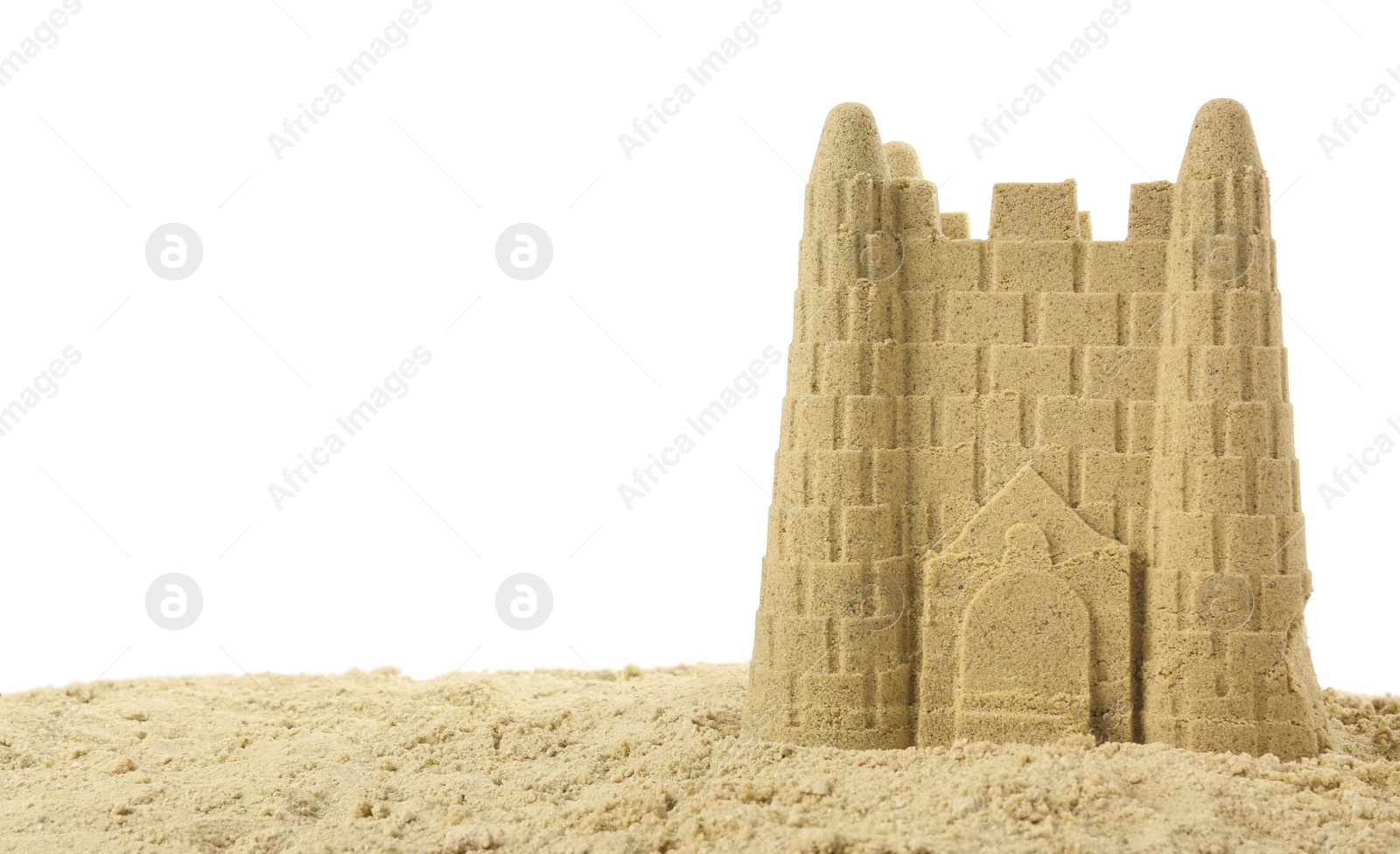 Photo of Pile of sand with beautiful castle isolated on white