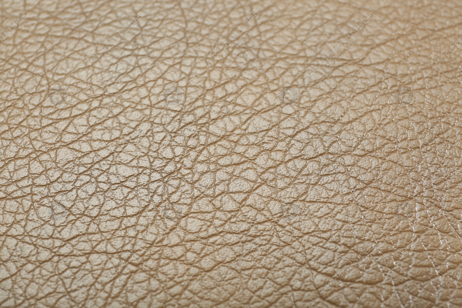 Photo of Texture of beige leather as background, closeup