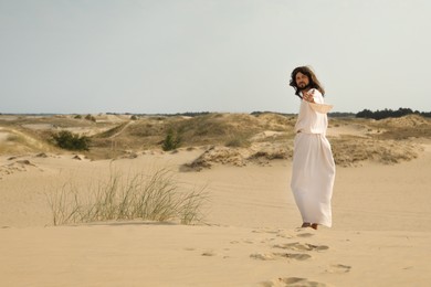 Photo of Jesus Christ walking in desert. Space for text