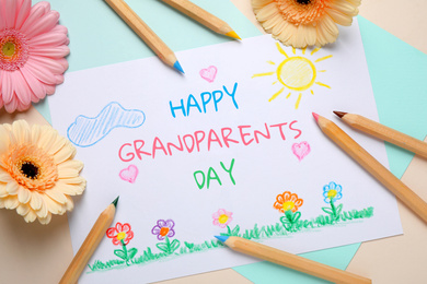 Image of Flat lay composition with drawing for Grandparents day on table