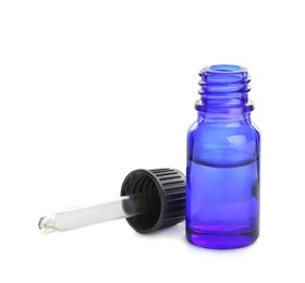 Photo of Little blue bottle with essential oil and dropper on white background