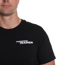 Photo of Personal trainer in uniform on white background, closeup. Gym instructor