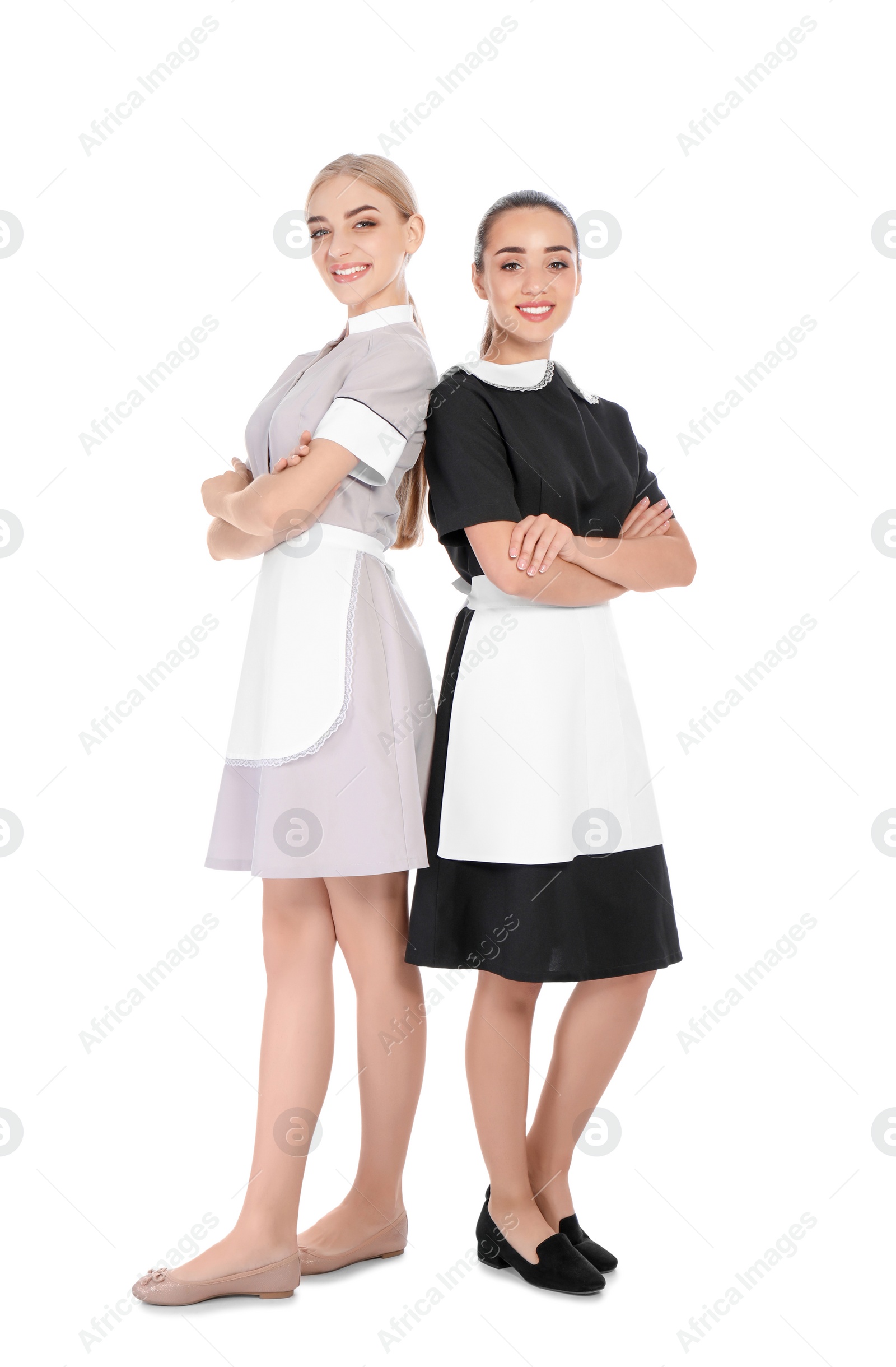 Photo of Full length portrait of young chambermaids on white background