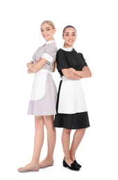 Full length portrait of young chambermaids on white background