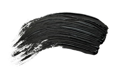 Photo of Brushstrokes of black oil paint on white background, top view