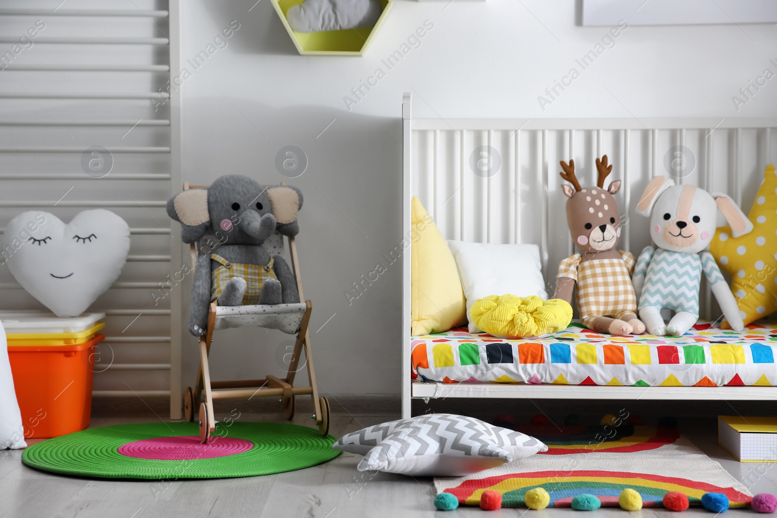 Photo of Baby room interior with stylish furniture and toys