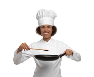 Photo of Happy female chef in uniform holding frying pan and spatula on white background