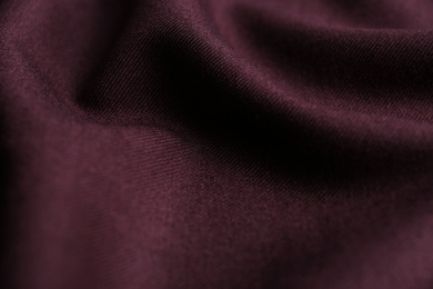 Photo of Texture of beautiful dark red fabric as background, closeup