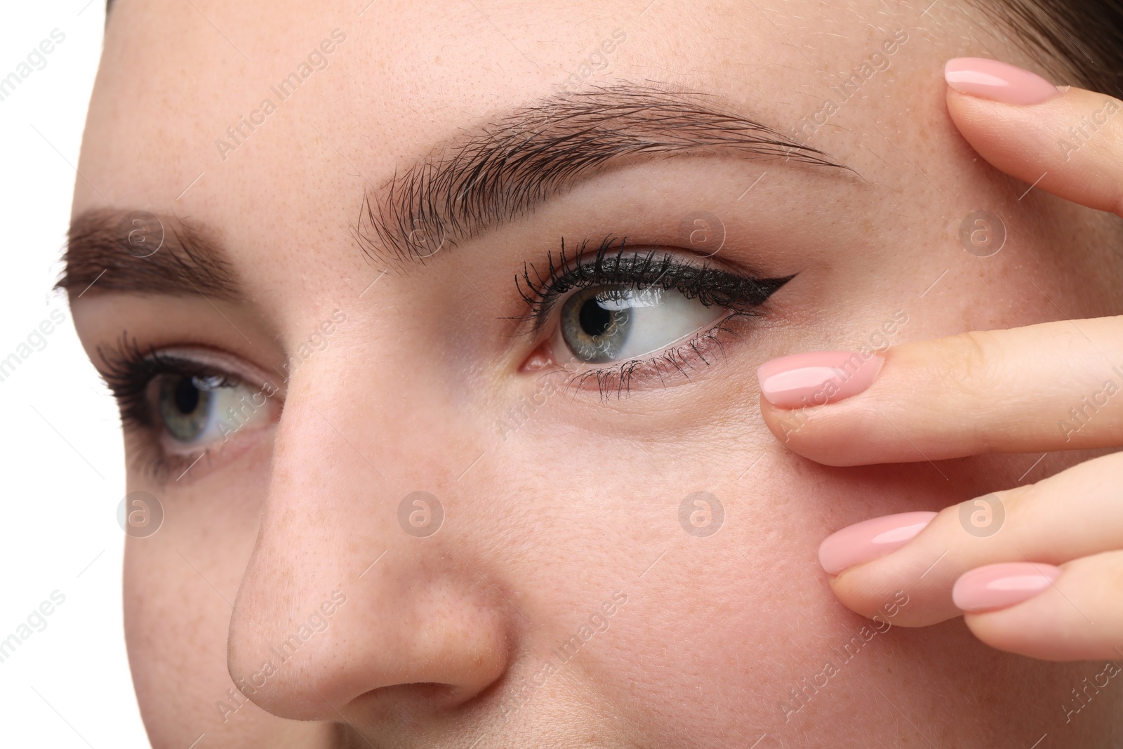 Photo of Makeup product. Woman with black eyeliner and beautiful eyebrows on white background, closeup