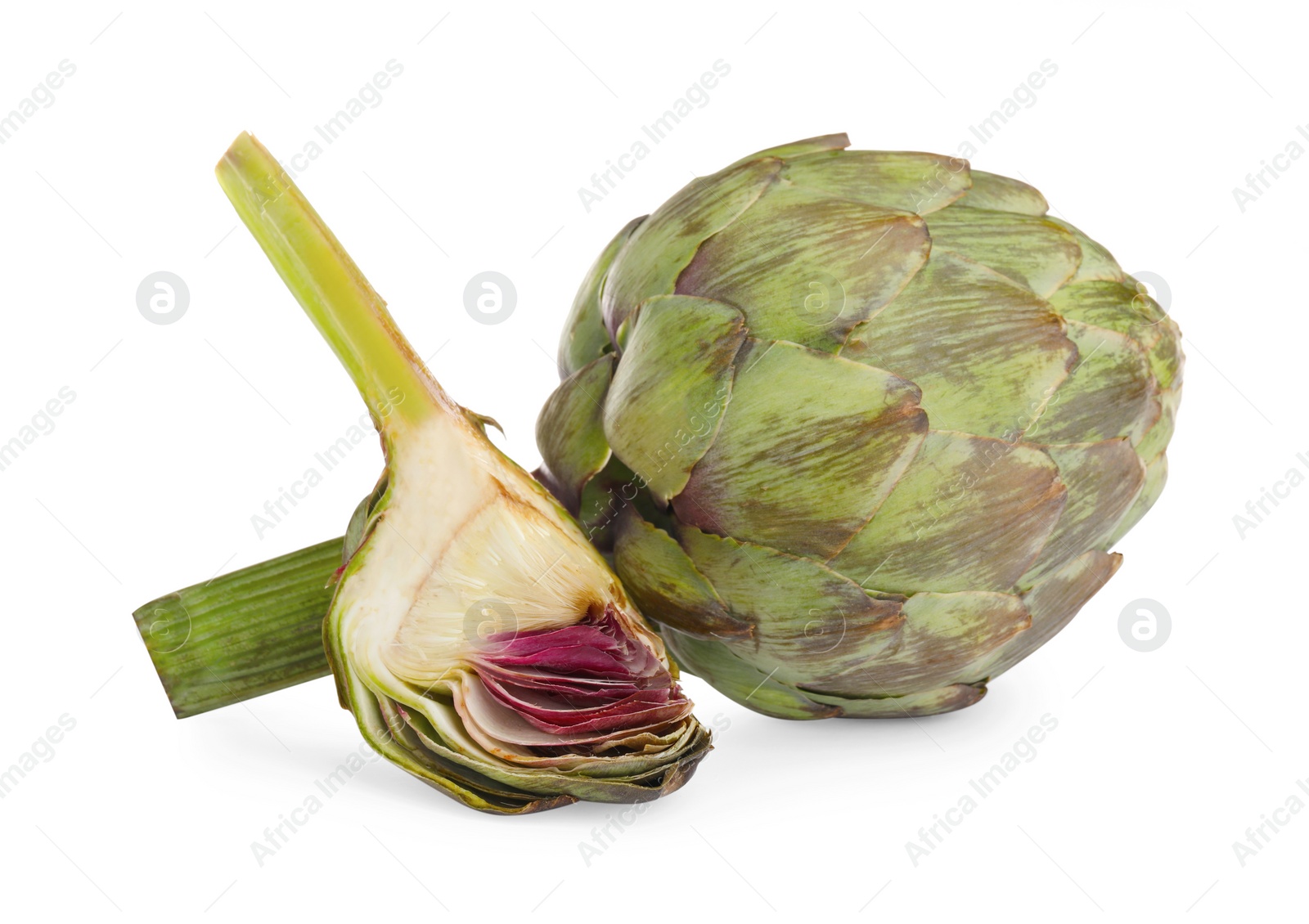 Photo of Cut and whole fresh artichokes on white background