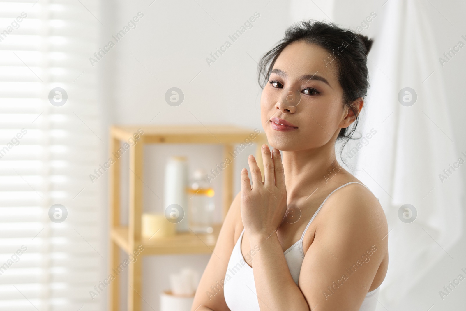 Photo of Portrait of beautiful woman with perfect skin indoors, space for text