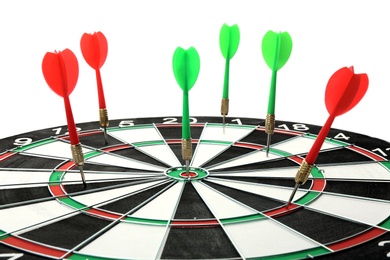 Photo of Dart board with color arrows hitting target, closeup