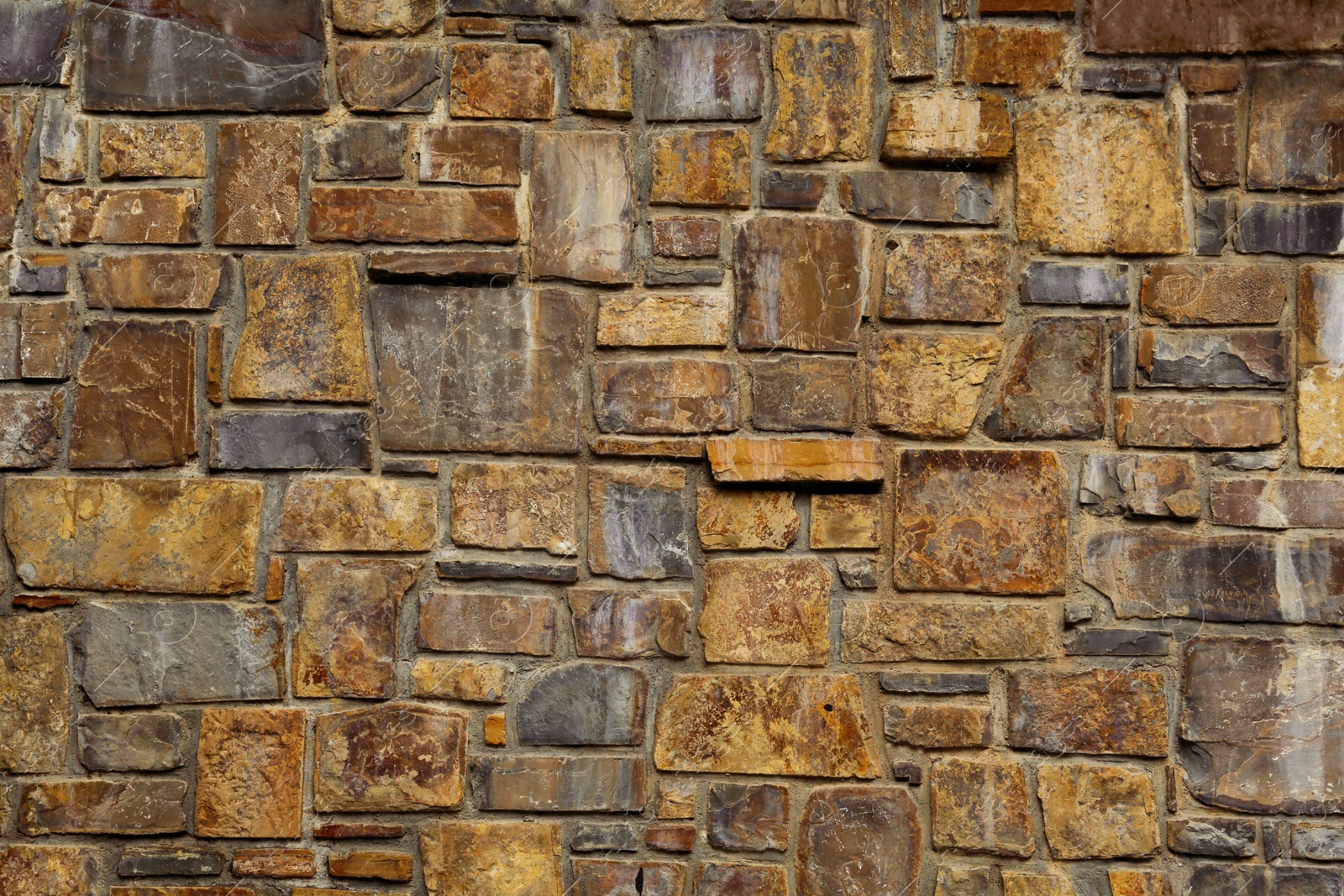 Photo of Beautiful stone wall as background, closeup view