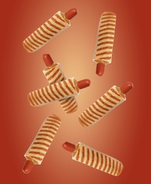 Yummy French hot dogs with grilled buns falling on red gradient background