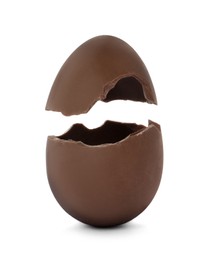 Broken milk chocolate egg on white background