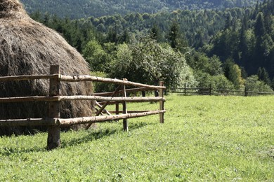 Beautiful view of mountain countryside with wooden fence