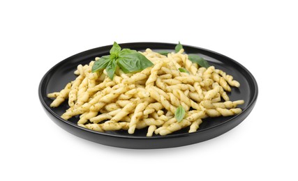 Plate of delicious trofie pasta with pesto sauce and basil leaves isolated on white