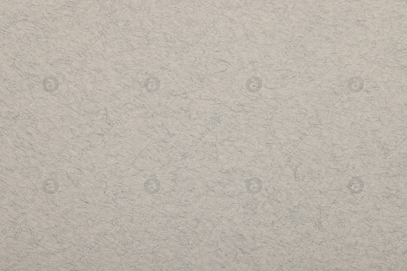 Photo of Texture of light grey paper sheet as background, top view