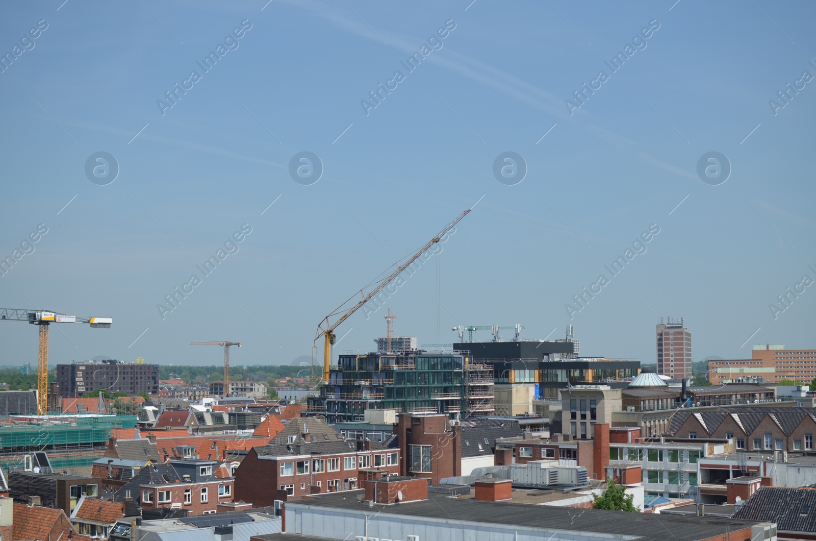 Photo of Picturesque view of city with beautiful buildings under blue sky