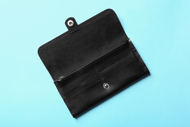 Photo of Stylish wallet on color background, top view