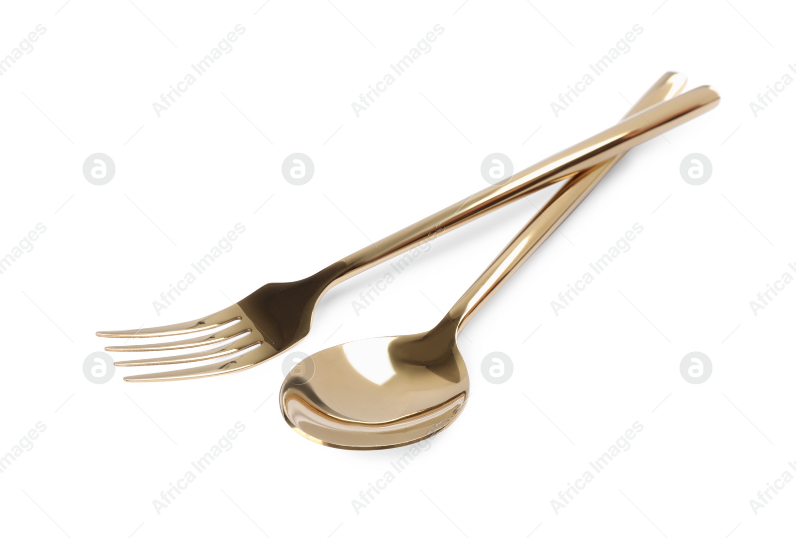 Photo of New shiny golden fork and spoon on white background