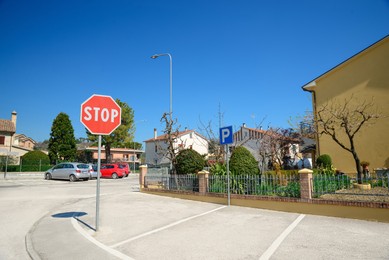 Photo of Road sign STOP on outdoor car parking lot
