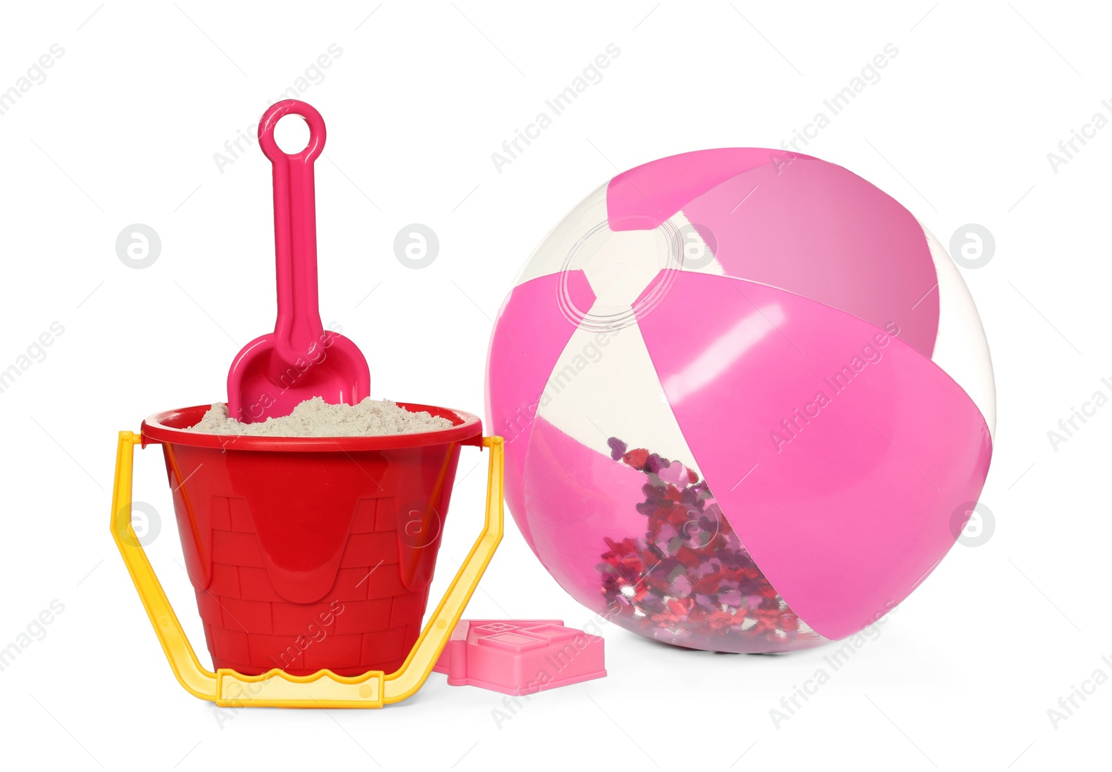 Photo of Inflatable beach ball and child plastic toys on white background