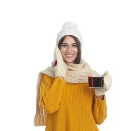 Photo of Happy beautiful woman with cup of mulled wine on white background