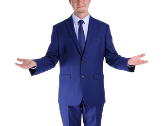 Businessman showing balance gesture on white background