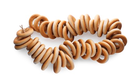 Bunch of delicious ring shaped Sushki (dry bagels) on white background, top view