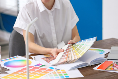 Photo of Professional interior designer at workplace in office, closeup