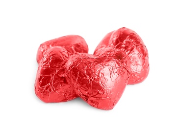 Photo of Heart shaped chocolate candies on white background