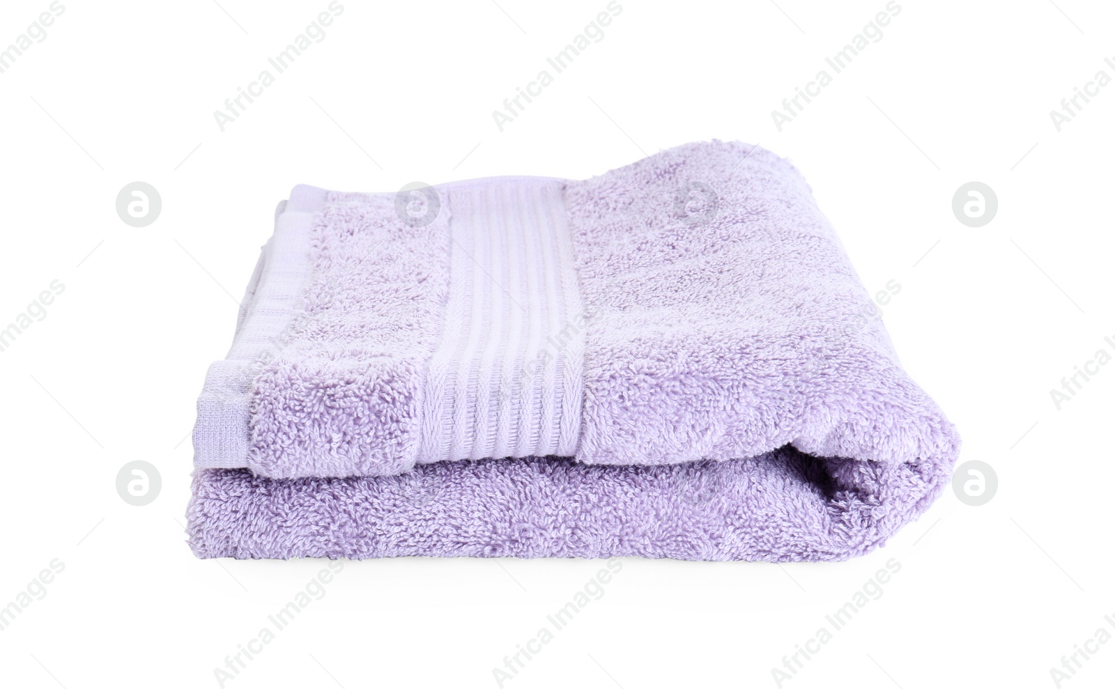 Photo of Folded violet terry towel isolated on white