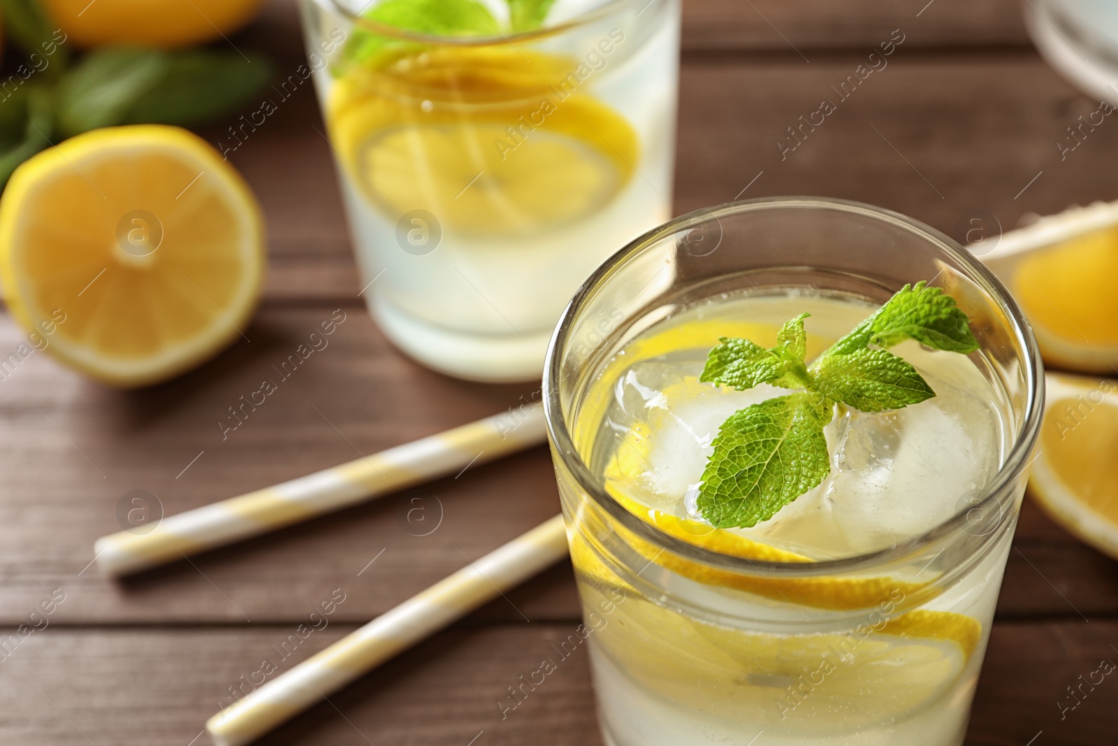 Photo of Glass with natural lemonade on table, closeup