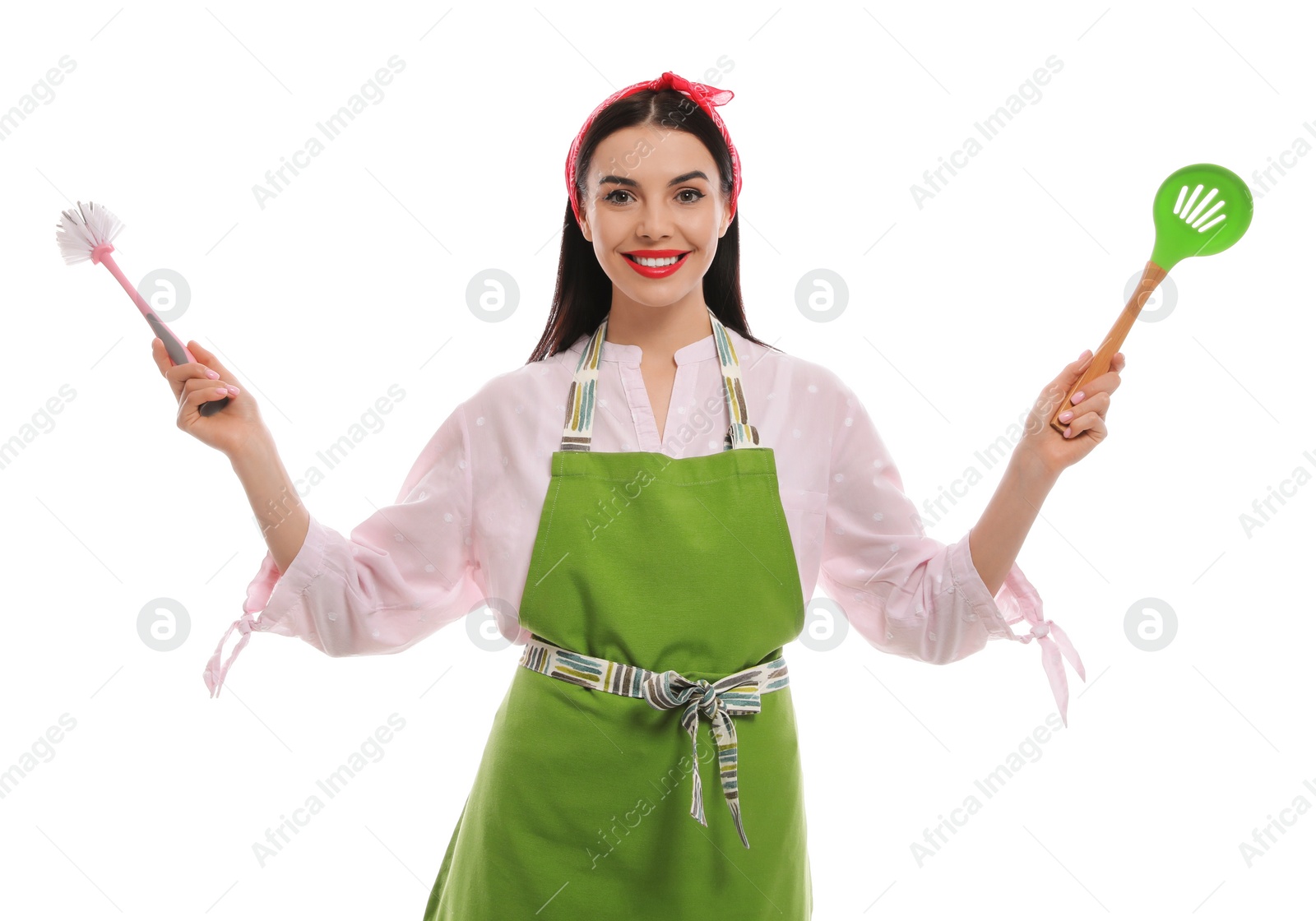 Photo of Young housewife with skimmer and brush on white background