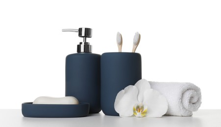 Photo of Bath accessories. Different personal care products and flower on table against white background