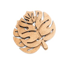 Leaf shaped wooden cup coasters on white background, top view